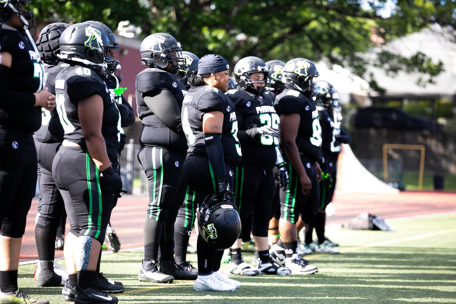 Phantomz team stands together on the sideline