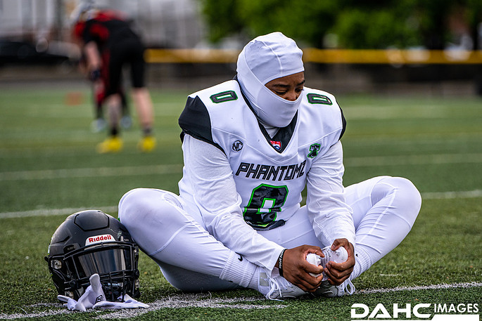 Phantomz player stretches before kickoff